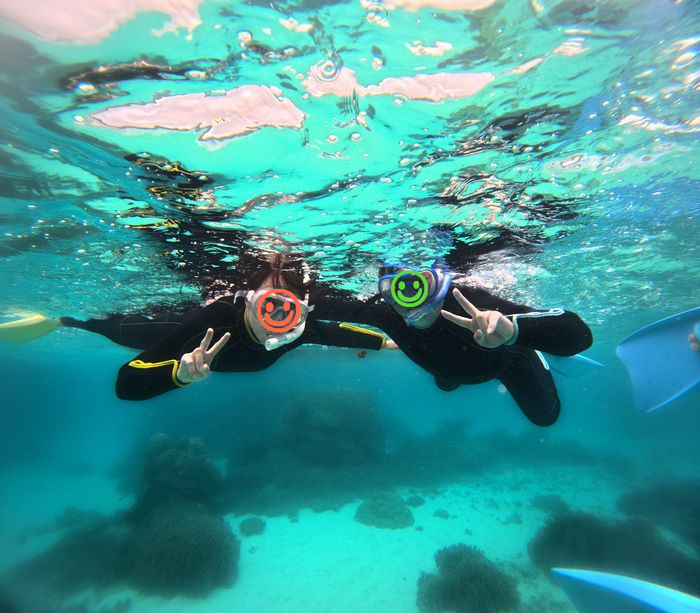 お父さんとお母さん余裕のピース